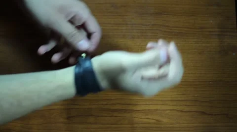 Taking Off The Leather Bracelet Stock Footage 65252236