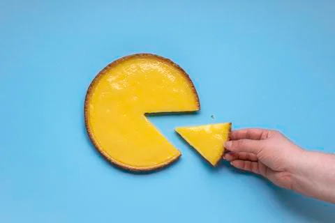 Taking lemon pie slice. Sliced lemon cake Stock Photos