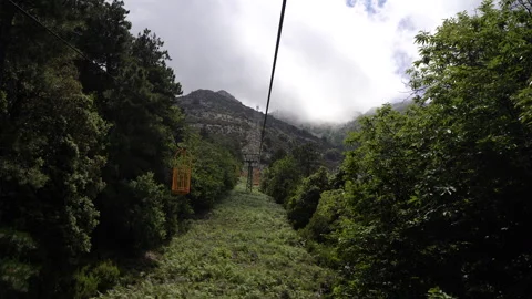 Taking the lift up the mountain. View from the cabin. Stock Footage 329556846