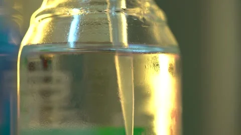 Taking liquids specimens with plastic pipette for analysis in lab Stock Footage 327046760