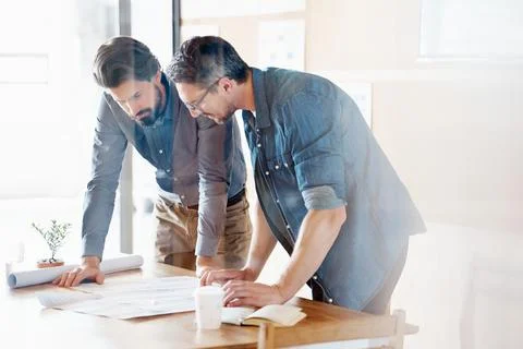 Taking a look at the blueprints Stock Photos