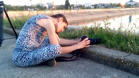 Taking Low Angle Pictures At Sunset Stock Footage 77023879