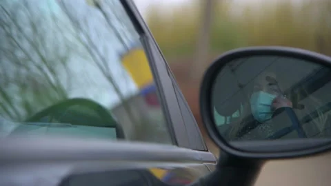 Taking Mask Off in Car Mirror Stock Footage 153120960