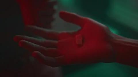 Taking MDMA Pill from Palm While Having Fun in Nightclub Stock Footage 279964480