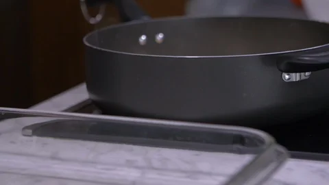 Taking Meat out of Pan Stock Footage 97780558