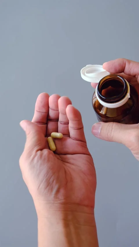 Taking Medicine from a Bottle Stock Footage 301092676