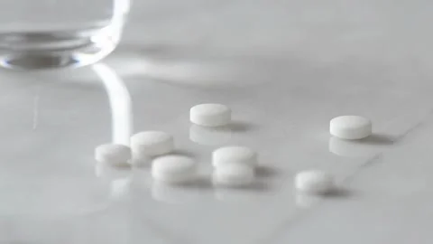 Taking medicine painkiller pills on hand capsules health care medicare pharmacy 스톡 동영상 336585953