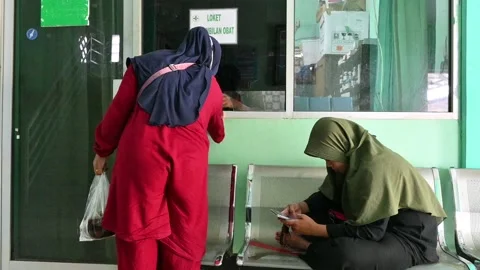 Taking medicine at a pharmacy Stock Footage 205020554