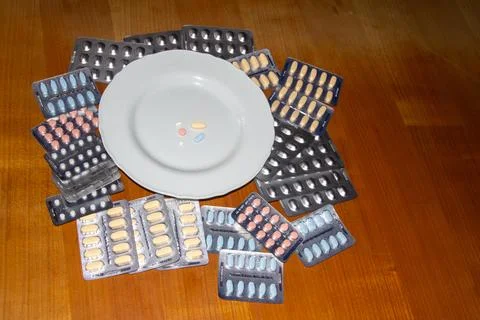 Taking medicines for breakfast Stock Photos