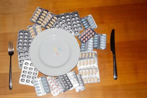 Taking medicines for breakfast Stock Photos