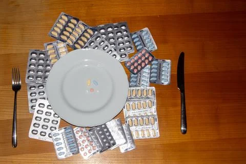 Taking medicines for breakfast Stock Photos