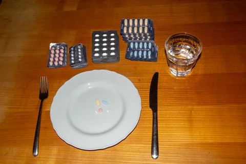 Taking medicines for breakfast Stock Photos
