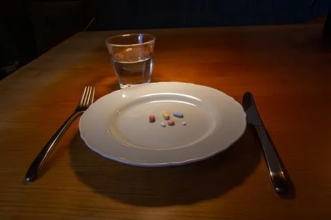 Taking medicines for breakfast Stock Photos