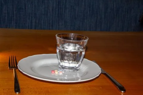 Taking medicines for breakfast Stock Photos