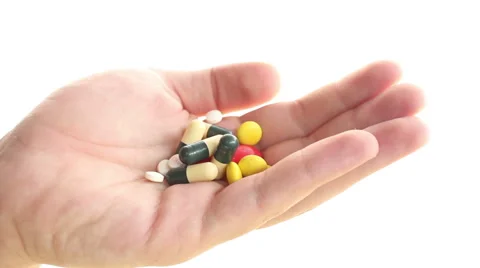 Taking medicines from the hand, isolated Stock Footage 67436060