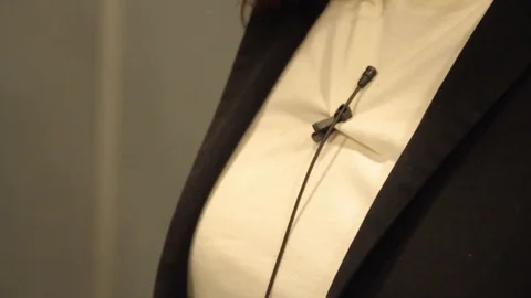 Taking off  microphone Stock Footage 125033571