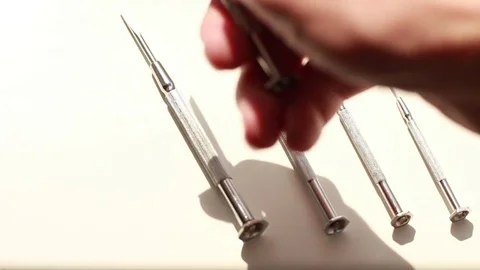 Taking mini screw drivers Vídeo Stock 74291917