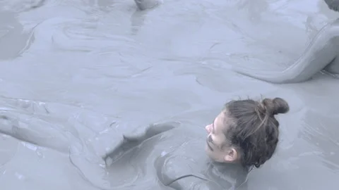 Taking a Mud Bath in Colombia Stock Footage 233605121