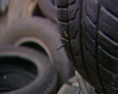 Taking a nail out from a tire Stock Footage 20512420