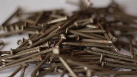 Taking nails from a pile Stock Footage 75827237
