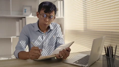 Taking note, Man's Hand Writing an Important Message in Notebook - Communicat Stock Footage 263463204