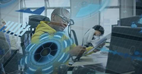 Taking notes African American man in yellow hoodie using pen on notebook in c 스톡 사진