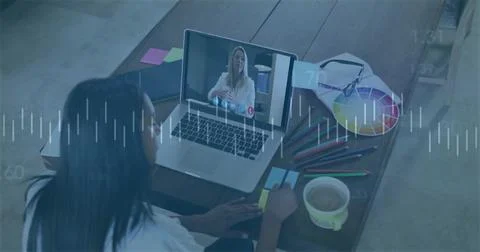 Taking notes graphic designer writing at home office desk, with laptop and color Stock Photos