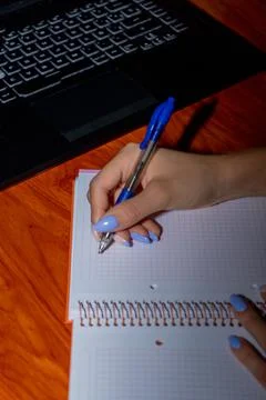 Taking notes in a notebook. Stock Photos