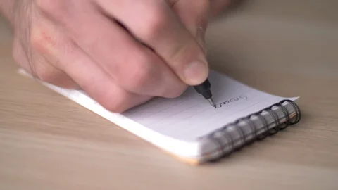 Taking Notes on a Small Notepad Closeup Focus Stock Footage 88341605