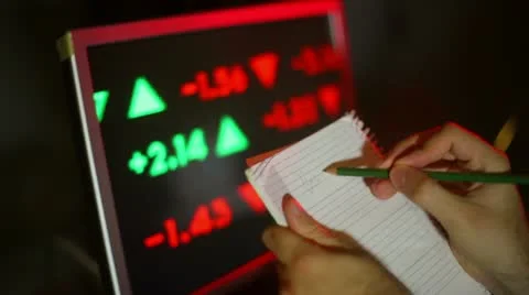 Taking notes on the stock market Stock Footage 11341054