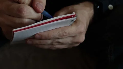 Taking notes writing in notepad, reporter, therapist, journalist psychiatrist 4K Video stock 345737278