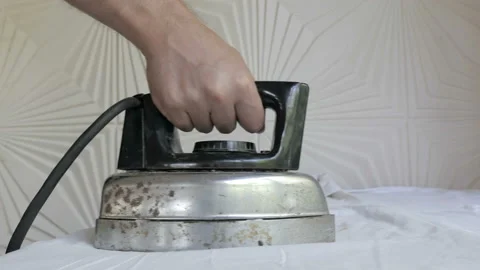 Taking Old Rusty Iron And Start Ironing Stock Footage 104298939