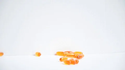 Taking omega supplements  Stock Footage 129767763