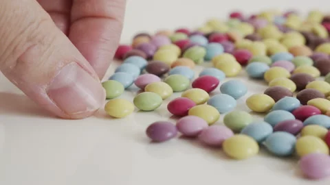 Taking of one chocolate candy with enamel surface 4K video Video stock 152268732