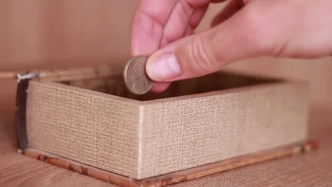 Taking one coin from the moneybox Vídeos de archivo 81584932