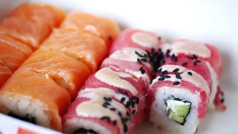 Taking one sushi roll from delivery box. Stock Footage 70674281