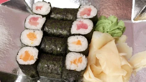 Taking one sushi roll from delivery box. Stock Footage 70807984