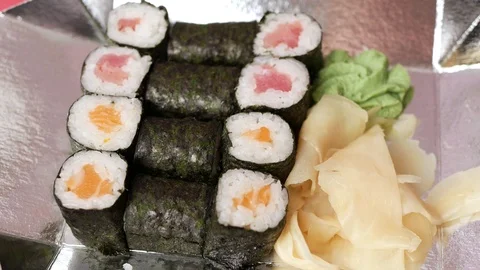 Taking one sushi roll from delivery box. Stock Footage 70808050