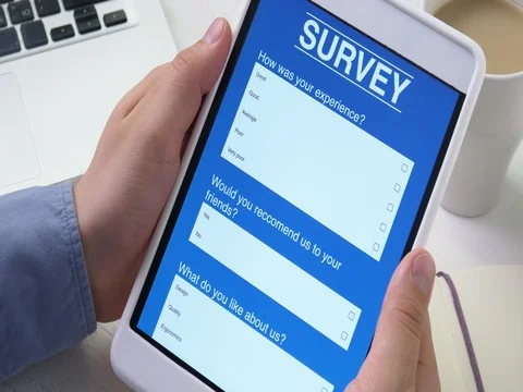 Taking online survey using smartphone digital tablet Stock Footage 79697604