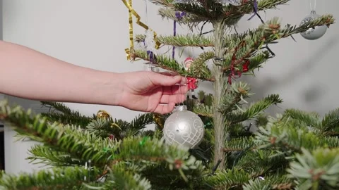 Taking the ornaments of a Christmas tree. Stock Footage 168835705