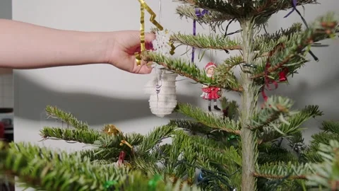 Taking the ornaments of a Christmas tree. Stock Footage 168835727