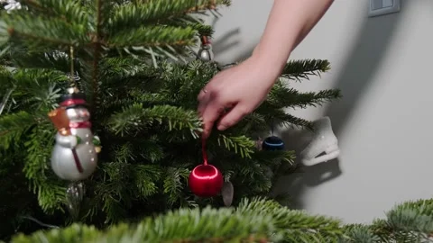 Taking the ornaments of a Christmas tree. Stock Footage 168835885