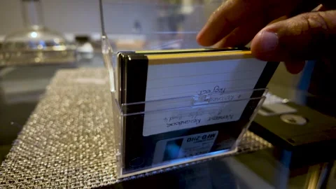 Taking Out 3.5 inch floppy diskettes storing data in a clear case Video stock 321211892