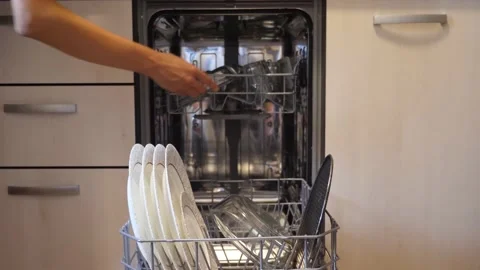Taking out the dishes from the dishwasher machine Video stock 145971173