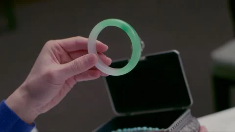 Taking out the jade bracelet from the box Video stock 261641844