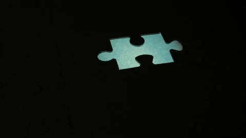 Taking Out One Puzzle Piece Illuminated Stock Footage 220741346