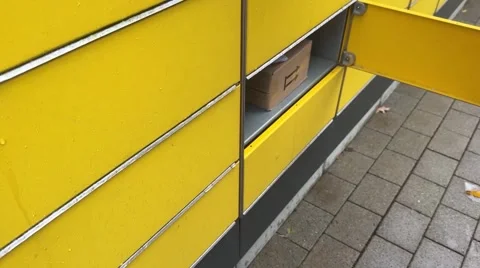 Taking out package from DHL station in Kassel Germany. Stock Footage 256649683