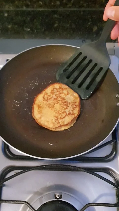 Taking out pancakes with a spatula Stock Footage 301805913
