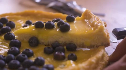 Taking out a piece of cheesecake Stock Footage 90159083