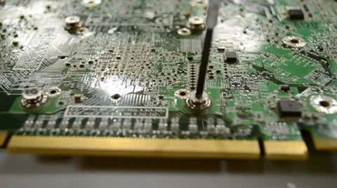 Taking out screw on circuit board Stock Footage 24184122